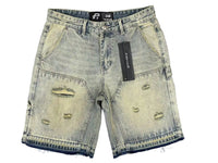Distressed denim shorts with a brand tag on a gray background
