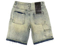 Light blue denim shorts with a black label on a gray textured background